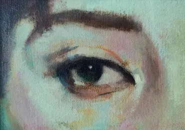 Close-up study of a green eye in soft pastel tones