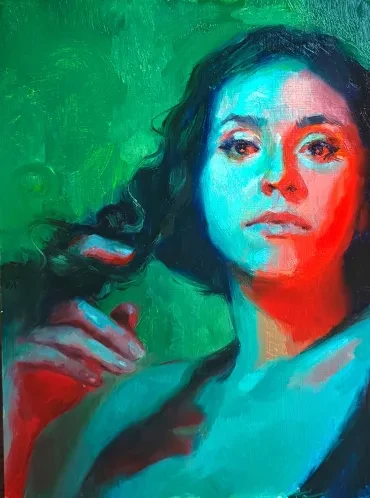 Portrait of a woman bathed in green and red light