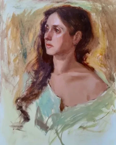Portrait of a young woman with long dark hair in a green shawl
