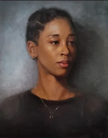 Portrait of a woman against a grey background